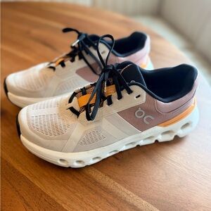 On Running Cloudstratus Cream and Orange Shoes